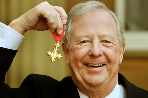 Tim Brooke-Taylor holds his OBE after it was presented to him by Prince Charles at Buckingham Palace in 2011. 