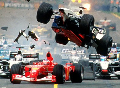 Williams team driver Ralf Schumacher from Germany flies through the air over the top of Ferrari driver Rubens Barrichello of Brazil.