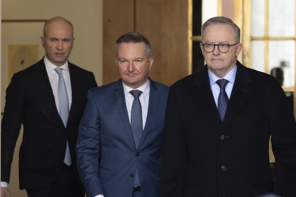 Matt Kean, Chris Bowen and Anthony Albanese arrive at a press conference today.
