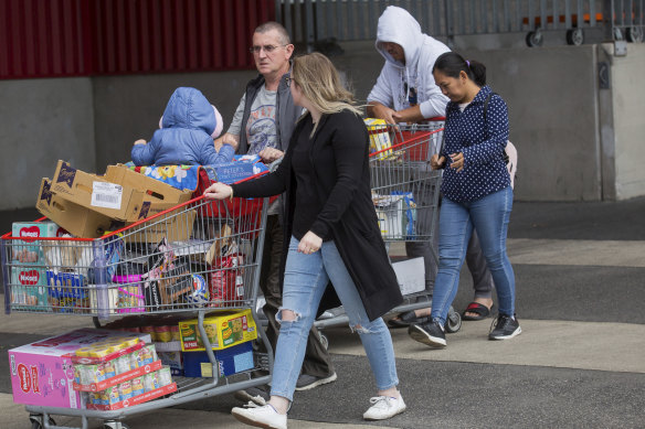 Shoppers stock up on supplies amid  the uncertainty over the coronavirus threat.

