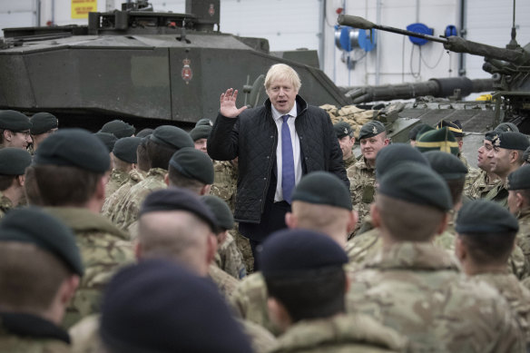 Prime Minister Boris Johnson addresses British soldiers after serving Christmas lunch to British troops stationed in Estonia last year.