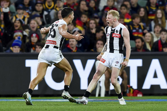 John Noble celebrates a goal with Nick Daicos during the Magpies’ stunning win.