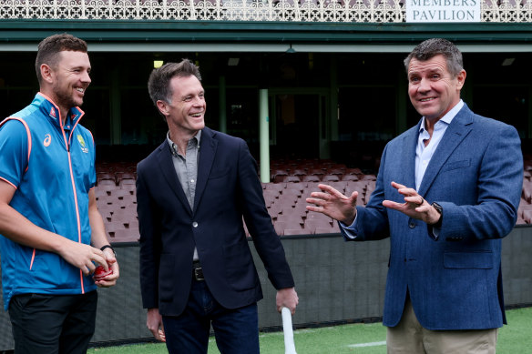 NSW Premier Chris Minns with former premier and Cricket Australia chairman Mike Baird and Australian cricketer Josh Hazlewood at the SCG on Sunday.