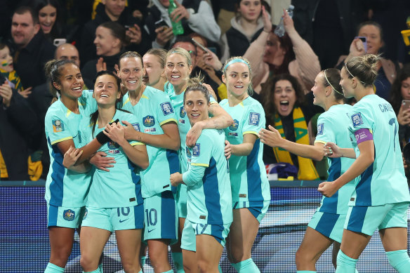 Hayley Raso of Australia celebrates with teammates after scoring her team’s second goal.