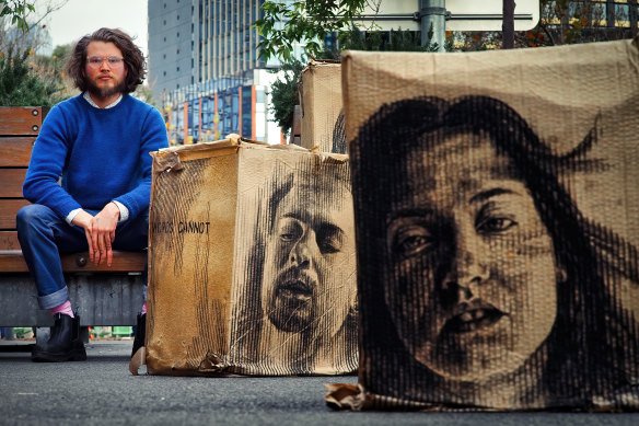 Daniel Coulson alongside his portraiture.