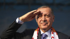 Turkish President Recep Tayyip Erdogan gives a military salute toward his supporters during a rally in Kayseri, Turkey on Saturday.