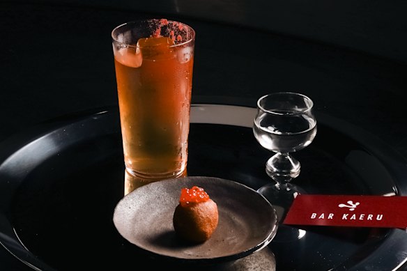 Sake cocktail with an ikura (salmon roe) doughnut.