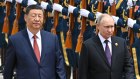 Xi Jinping and Vladimir Putin  review the honour guard during an official welcome ceremony.