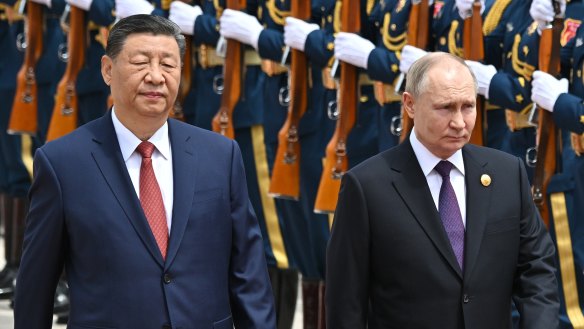 Xi Jinping and Vladimir Putin  review the honour guard during an official welcome ceremony for the Russian leader.