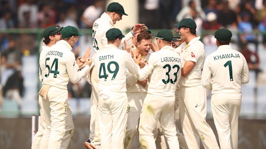 Todd Murphy leaps with joy after Matt Kuhnemann claims Virat Kohli for a maiden Test wicket.