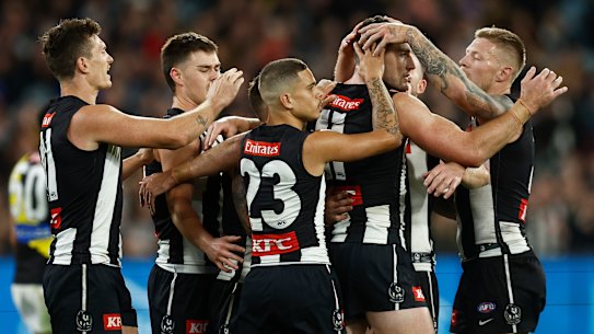 Collingwood celebrate a late goal.