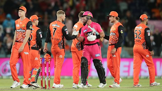 Sydney Sixers star Dan Christian shakes hands with Dan Christian of the Scorchers, who are wearing their Indigneous strip.