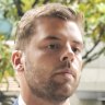 Daniel Keneally enters the Downing Centre court complex on Thursday for his sentencing for fabricating evidence.