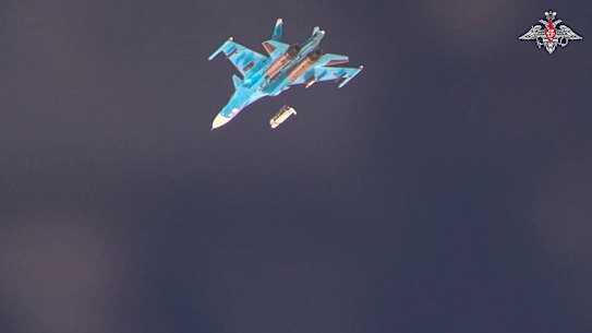 An SU-34 drops a glide bomb over Ukrainian positions in an image released by the Russian Defence Ministry last year.
