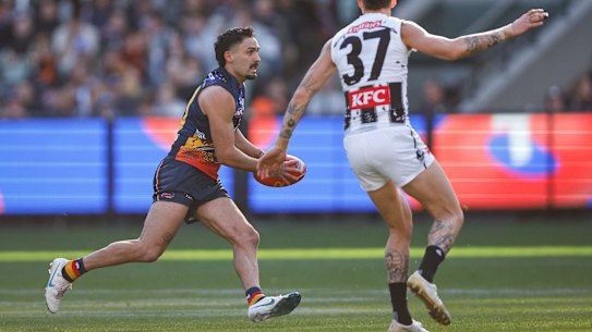 Izak Rankine breaks free for the Crows.