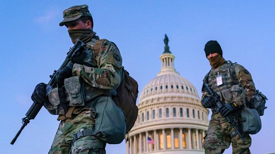 National Guard troops and the US Capitol Police keep watch on the Capitol in March 2021 amid heightened security.
