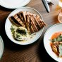 Grilled garlic flat bread, whipped ricotta, smoked olive oil and bottarga at the Hobsons Bay Hotel.
Photo Kate Shanasy.
For Good Food rooftop bar story by Carrie Hutchinson.