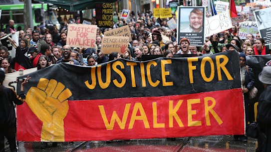 Aboriginal and Torres Strait Islanders communities and allies march during a protest in Melbourne on Wednesday.