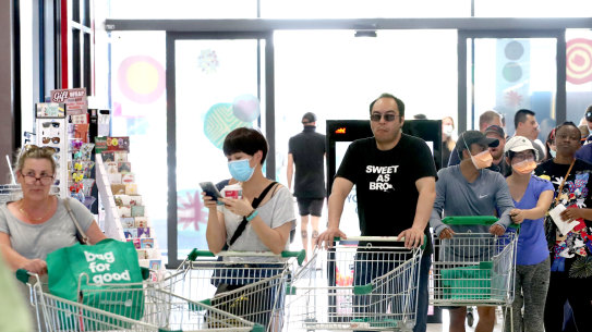 ADELAIDE, AUSTRALIA - NOVEMBER 18: People queuing at Woolworths at West Torrens on November 18, 2020 in Adelaide, Australia. South Australian premier Steven Marshall has announced new lockdown restrictions across the state for the next six days in 