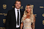Kieran Foran of the Manly Sea Eagles and wife Karina May are turning heads – Karina’s semi-sheer gown is bedazzled with a beautiful Art Deco-like motif.