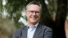Guy Debelle says the world must move faster toward net zero. 