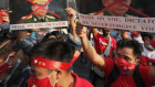 International condemnation. Burmese living in Thailand march in the streets against the coup led by  Commander-in-Chief Senior General Min Aung Hlaing.