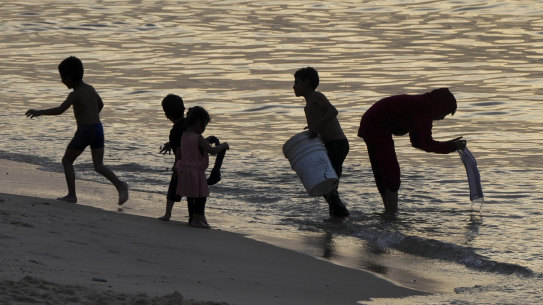 Palestinians visit the beach in Deir al Balah, Gaza Strip, on the second day of a cease-fire between Israel and Hamas.