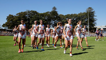 Giants players leave the field after losing to Fremantle on Sunday.