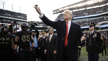 Donald Trump tosses the coin before the Army-Navy college football game in Philadelphia on Saturday.