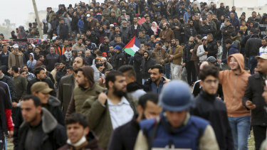 Tens of thousands of protesters gather near the Gaza Strip's border with Israel on Saturday, March 30.