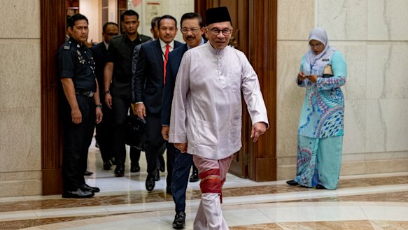 Anwar Ibrahim arrives at the prime minister’s office for his first day as Malaysian leader last Friday.