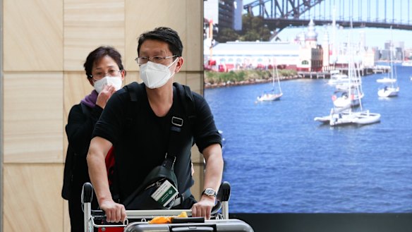 Passengers from Wuhan arrive at Sydney Airport on the last flight out of the city last week.
