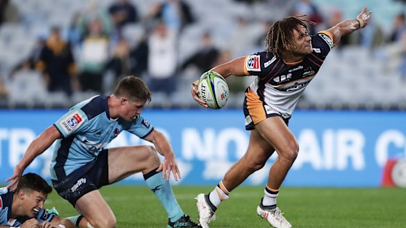 Issak Fines celebrates a try for the Brumbies.