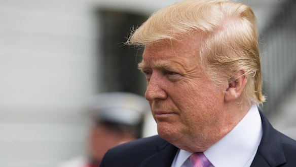 US President Donald Trump walks on the South Lawn of the White House.