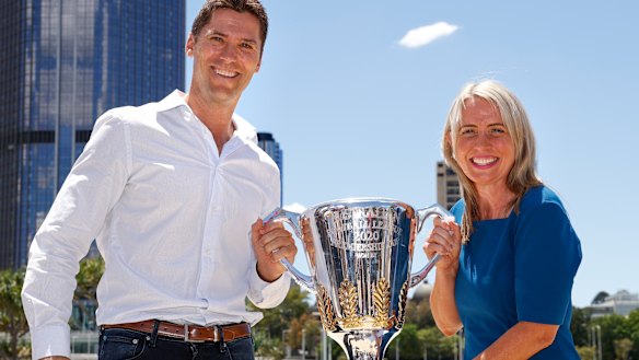Simon Black and Tourism Minister Kate Jones MP with the AFL premiership trophy.