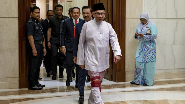 Anwar Ibrahim arrives at the prime minister’s office for his first day as Malaysian leader last Friday.