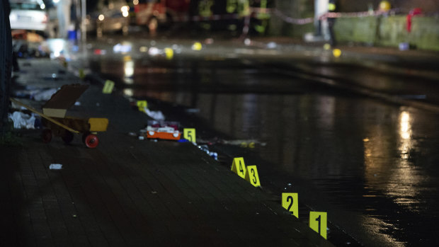Investigators' markings are seen near the car that drove into a crowd of people during a carnival procession in Volkmarsen.