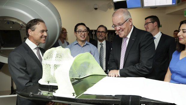 Prime Minister Scott Morrison and Health Minister Greg Hunt visit the Icon Cancer Centre in Canberra on Monday.
