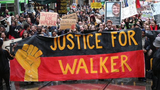 Protesters march in Melbourne over the death of Kumanjayi Walker.
