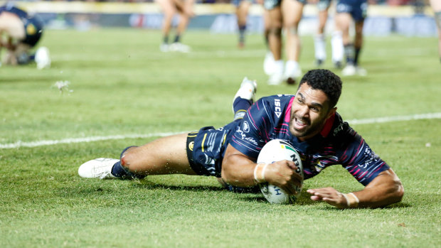 Justin O'Neill scores a try for the Cowboys.