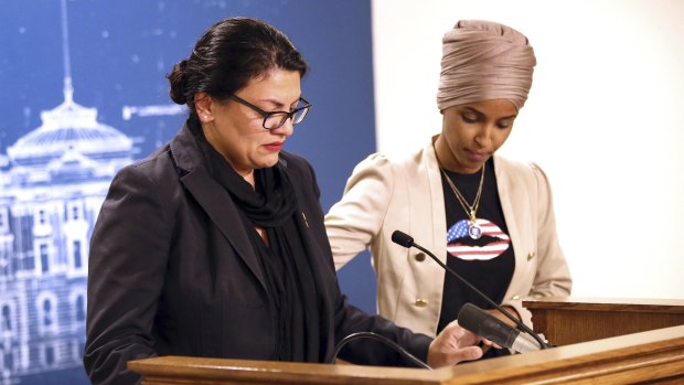 lhan Omar, right, consoles Rashida Tlaib during a news conference in Minnesota on Monday, local time.