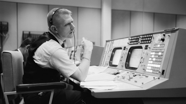 In a photo provided by JSC/NASA, Eugene F. Kranz, flight director, in the control room during the Gemini program, preparing for a four-day flight, in Houston, May 30, 1965. 