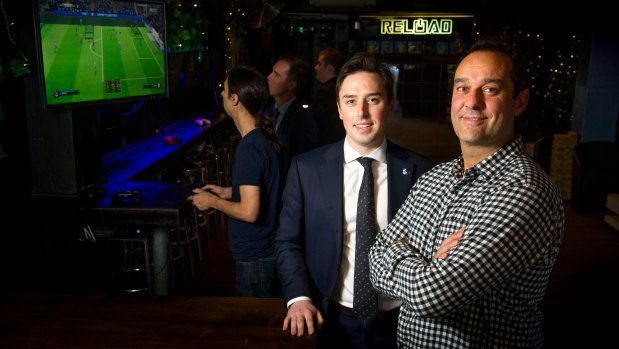 MLA Michael Pettersson wants to capture a corner of the booming Asian tourism market in video gaming as a spectator sport. Pictured with Reload co-owner Ravi Sharma.