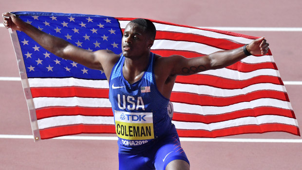 Christian Coleman celebrates his 100m victory at last year's World Athletics Championships in Doha.