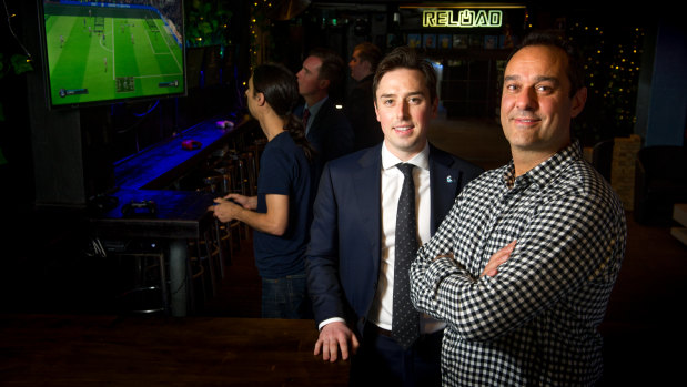 MLA Michael Pettersson wants to capture a corner of the booming Asian tourism market in video gaming as a spectator sport. Pictured with Reload co-owner Ravi Sharma.