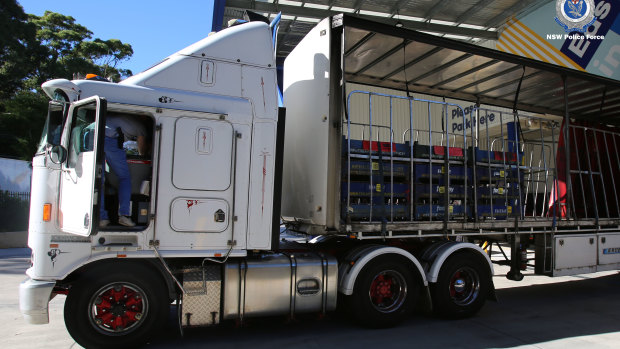 Police raid a storage unit at Cromer on Monday, where they arrested a truck driver.