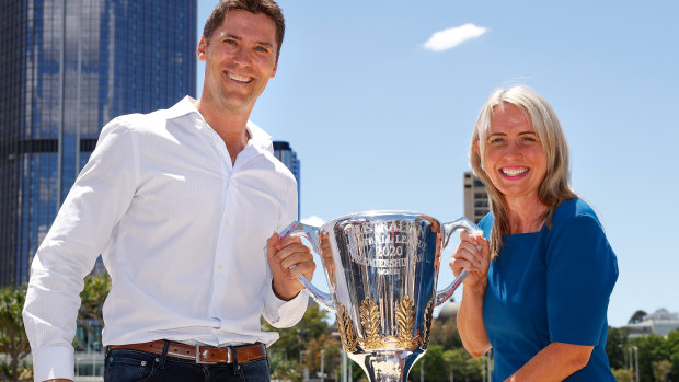 Simon Black and Tourism Minister Kate Jones MP with the AFL premiership trophy.