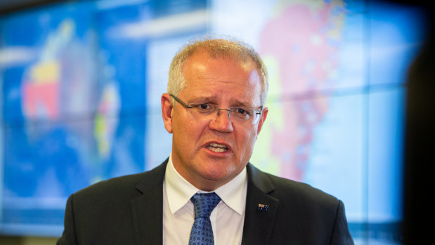 Prime Minister Scott Morrison at a crisis co-ordination centre. 
