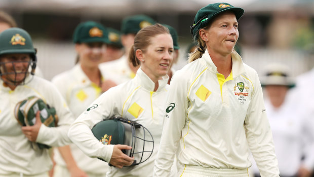 Australian captain Meg Lanning leads her team off the field after the Test match finished in a draw. 