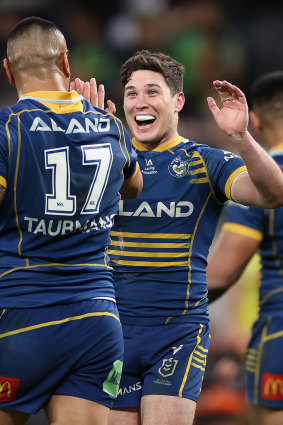 Marata Niukore celebrates with Mitchell Moses.